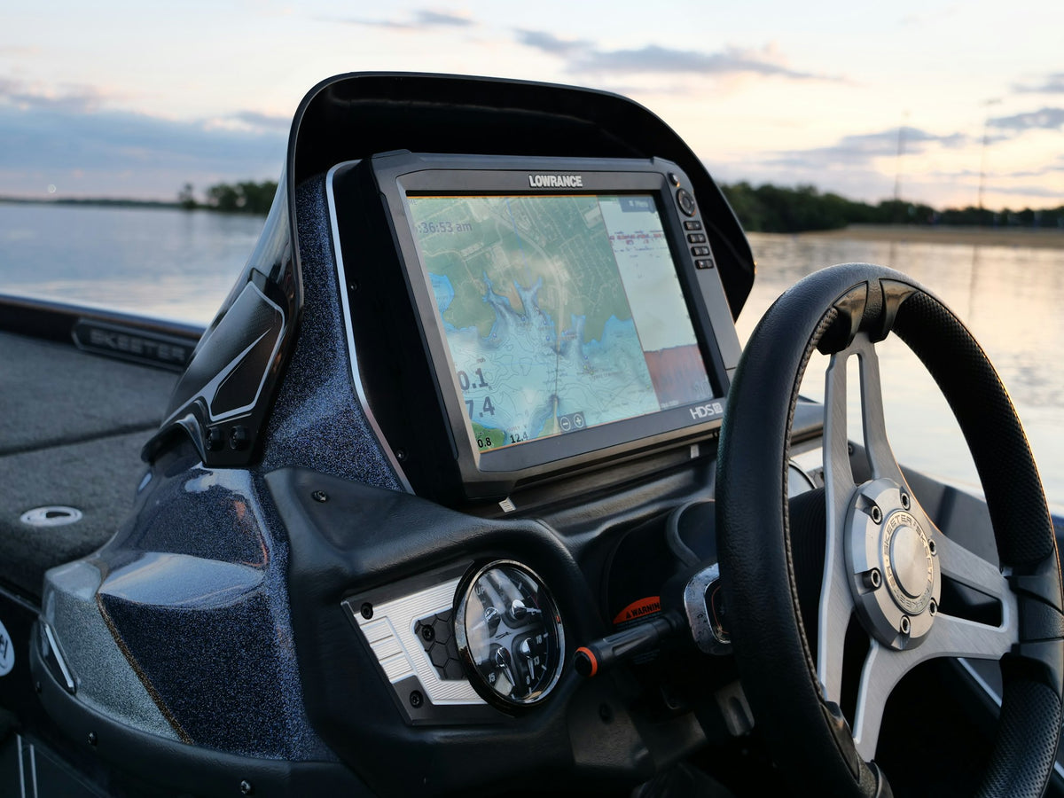 Fish finder and GPS unit mounted on the console of a bass boat