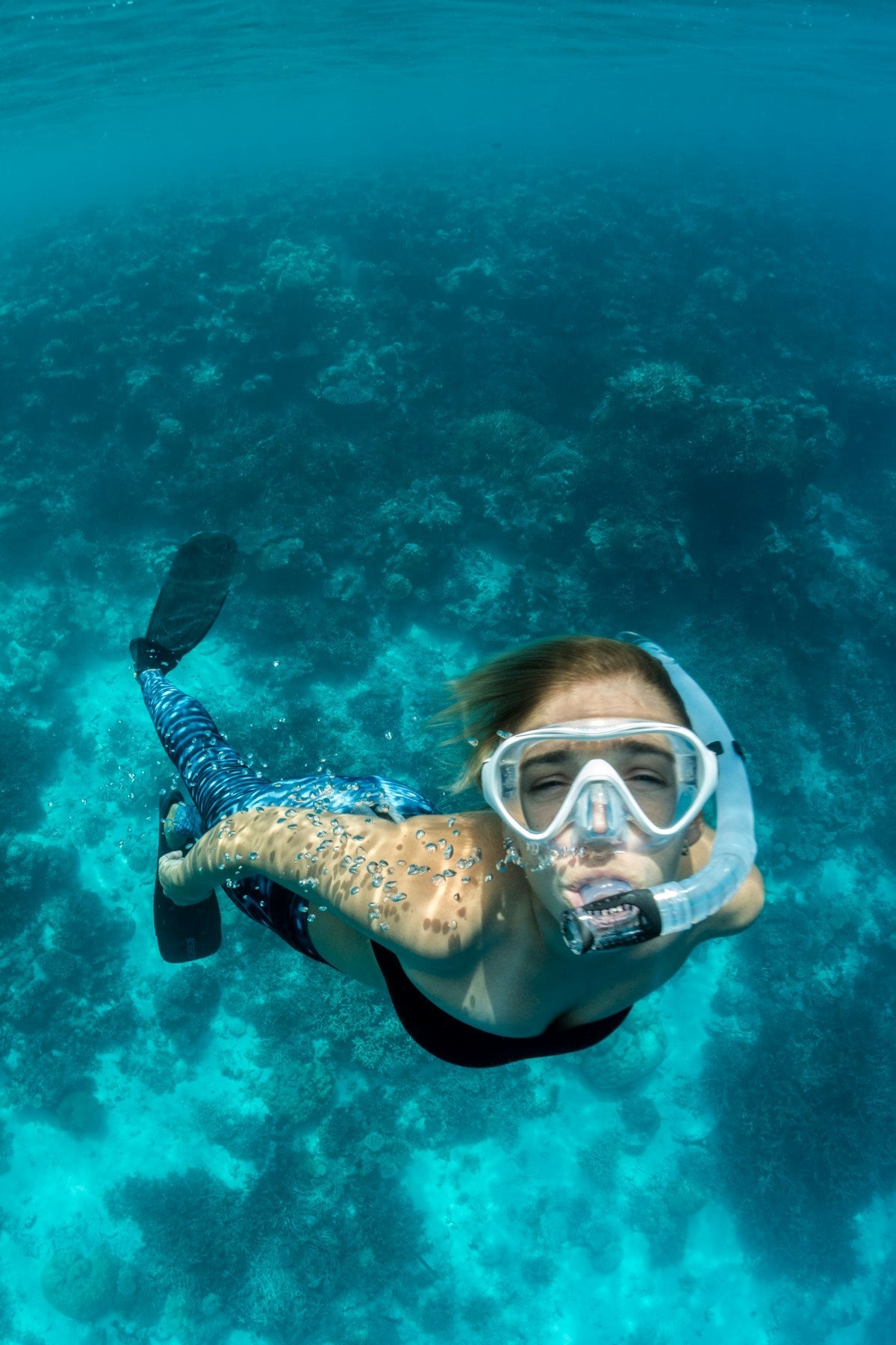 Snorkeler in clear ocean water